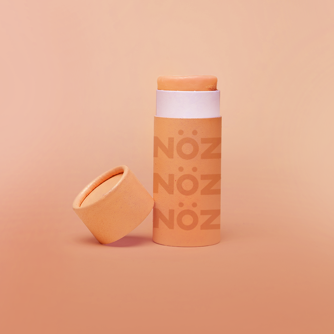 Noz Funscreen in Sun Kissed Orange color in front of gradient orange background