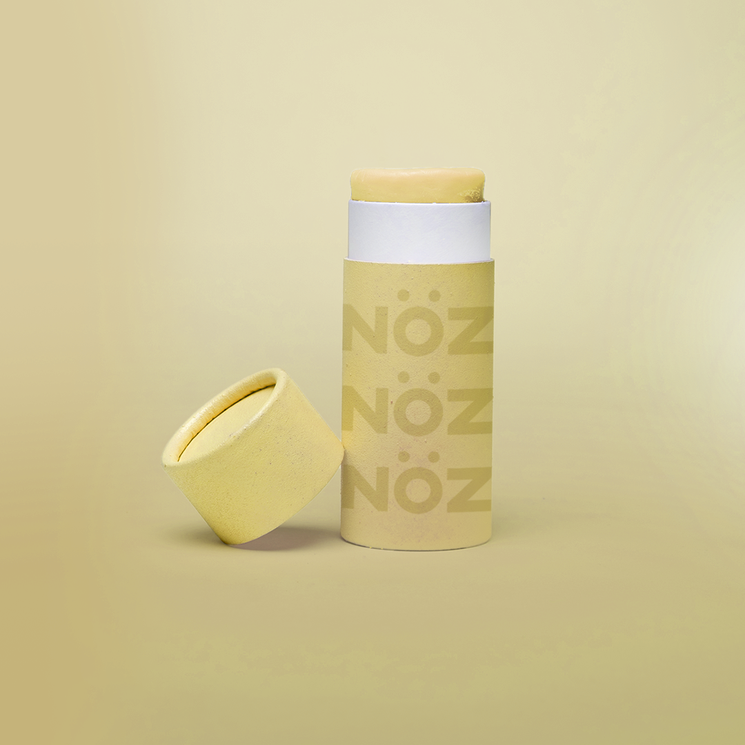 Noz Funscreen in Playful Sunshine yellow color in front of gradient yellow background 